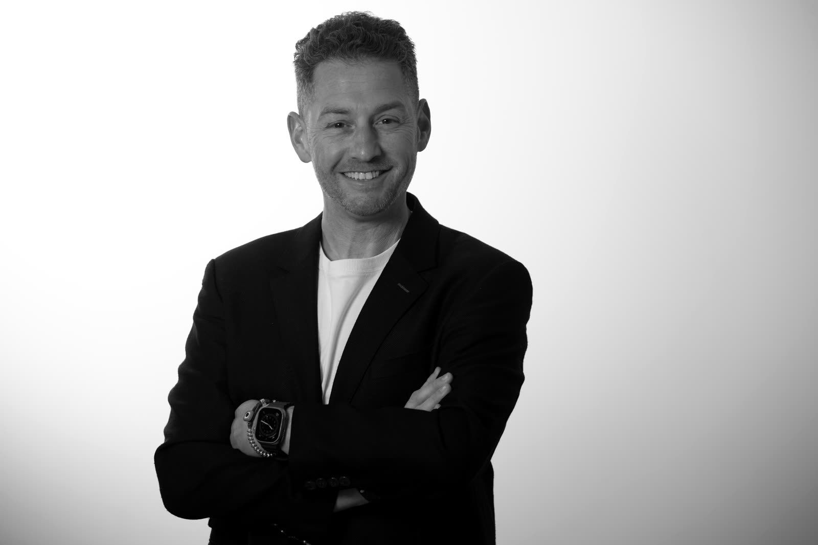 Dan Gildoni, founder of Gildoni Ltd. Editorial black-and-white portrait.